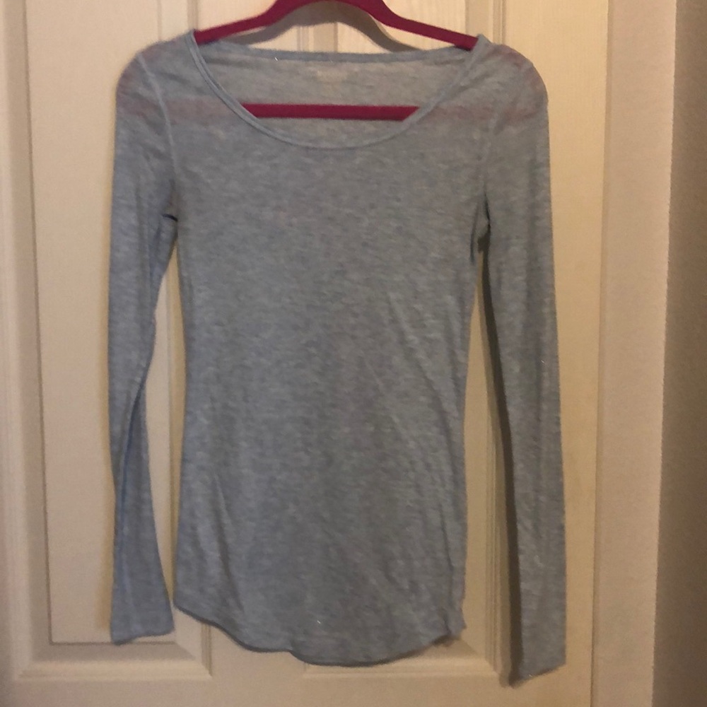 Long sleeve light blue sparkly shirt.